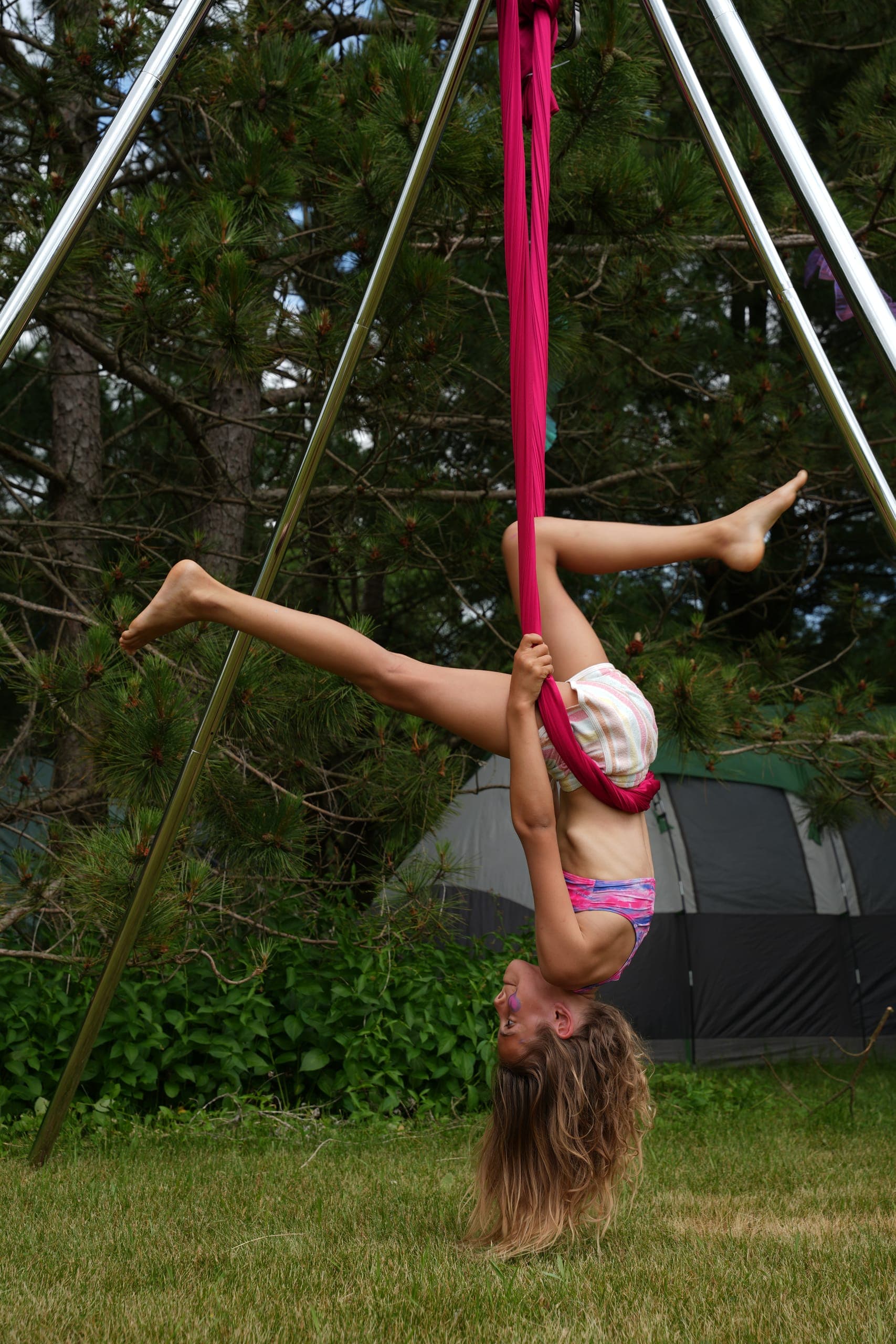 Linda performing aerial silks at a festival