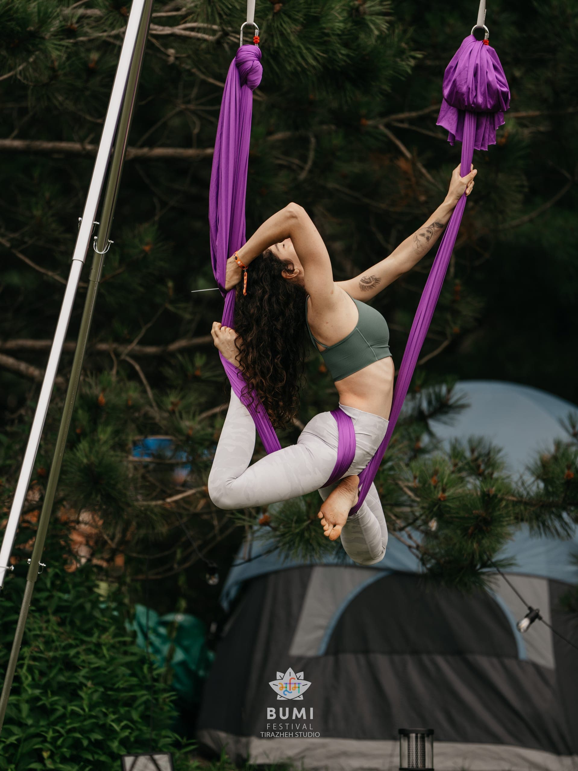 Linda guiding students in an aerial workshop