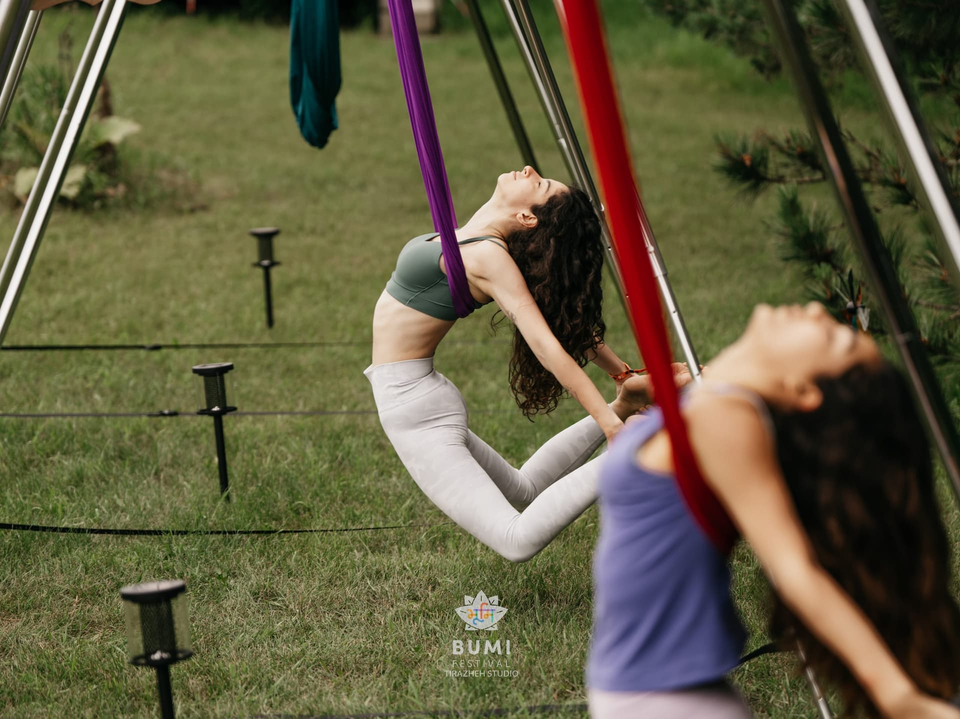 Linda flowing through yoga outdoors